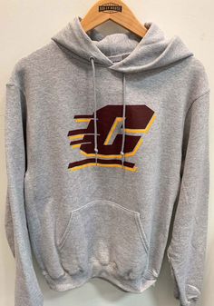 Put your Chippewas spirit on display in this Central Michigan Chippewas Long Sleeve Hoodie! You'll be cozy on game day in this CMU Chippewas Mens Grey Big Logo Hooded Sweatshirt. This Chippewas Long Sleeve Hoodie features a screen printed big team logo on front chest. Wear your Central Michigan Chippewas spirit with pride in this great Mens Hooded Sweatshirt! Screen printed team logo on chest, Super soft fleece, Ribbed cuffs and waistband, Front pouch pocket, Double needle reinforced seams, Cham Cotton Sweatshirt For Sports Season Outdoor Activities, Cotton Sweatshirt For Outdoor Activities During Sports Season, Cotton Sweatshirt For Outdoor Activities, Gray Sports Sweatshirt With Kangaroo Pocket, Gray Sports Hoodie With Logo Print, Gray Sweatshirt With Kangaroo Pocket For Sports, Collegiate Sports Sweatshirt With Kangaroo Pocket, Gray Varsity Hoodie For Sports, Gray Team Spirit Sweatshirt For Sports