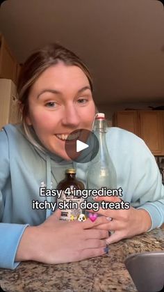 a woman sitting at a kitchen counter with a bottle in her mouth and the caption easy 4 ingredient itchy skin dog treats