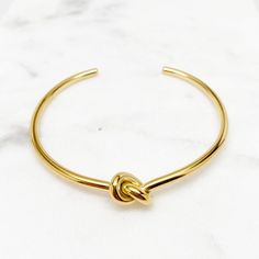 Delicate Bracelets for Women, Dainty Bracelets for Women, Tie the Knot Bracelet, Minimalist Bracelets ♥ Material: Hypoallergenic and Non Tarnishing Stainless Steel, High Quality and Long Lasting Color ♥ Color: Silver, Gold ♥ Width: 2.5 inches (63 mm) / Adjustable Cuff For Rose Gold -> https://www.etsy.com/listing/849684570 ♥ Thickness: 2.9 mm - for thinner 2.0 mm thickness: https://www.etsy.com/listing/733932305 - for thicker 3.8 mm thickness: https://www.etsy.com/listing/843125959 ♥ Gift Box Adjustable Gold Bracelets For Bridesmaids, Adjustable Gold Bracelet For Bridesmaid Gift, Hypoallergenic Bangle Bracelets For Wedding, Gold Cuff Bracelet For Bridesmaid Gift, Adjustable Gold Bangle For Bridesmaids, Adjustable Bangle Bracelets For Bridesmaid Gift, Minimalist Bracelets, Love Knot Bracelet, Gold Minimalist Jewelry