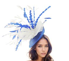 White Royal Blue Feather Kentucky Derby Fascinator Hat Wedding Fascinators Cocktail Garden Party White Ascot Hat Formal Occasion Races Woman Hat Hats By Cressida Kentucky Derby & Ascot Fascinator Hats Spring Summer Hat & Fascinator Collection White and Royal Blue Kerina Fascinator Saucer Disc  Super cute white crin trimmed with royal blue & white hackle and coque feathers on a royal blue base Base measures 10 inches About 20 inches wide with feathers This white and royal blue headpiece is mounte Blue Feathered Headpieces For Royal Ascot, Royal Blue Spring Party Fascinator, Blue Feathered Fascinator For Spring, Blue Feathered Fascinator Hat, Cocktail Garden Party, Cocktail Garden, Blue Wide-brim Fascinator For Kentucky Derby, Blue Headpiece, Woman Hat