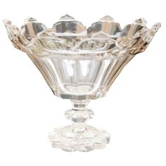 a clear glass vase sitting on top of a table