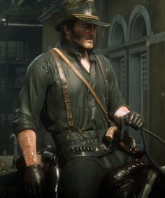 a man in a hat and leather outfit standing next to a horse