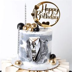 a birthday cake with an image of a man in a tuxedo on it