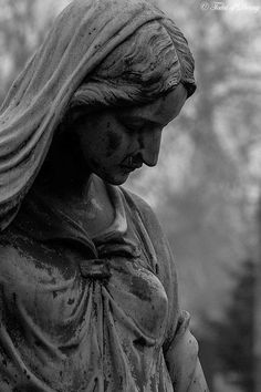 black and white photograph of a statue of a woman