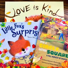 three children's books about fall and love are on a table with autumn leaves