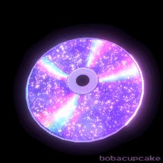 an image of a disc that is glowing in the dark with stars and colors on it