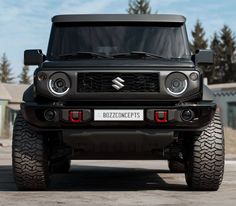 the front end of a black suzuki pickup truck