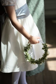 The flower girl at this Napa Wedding wore a delicate wreath of flowers, symbolizing the simplicity and beauty of nature. Every detail, from the floral arrangements to the charming basket of petals, reflected the surrounding California landscape. Napa Wedding, California Landscape