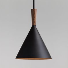 a black and wooden light hanging from a ceiling