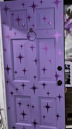 a purple door with stars painted on it