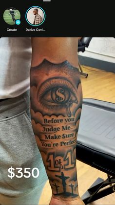 a man's arm with an eye tattoo on it