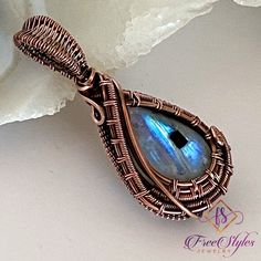 "White Rainbow Moonstone in copper.  Gorgeous moonstone cabochon in a unique wire woven setting. Fashioned in pure (99.9%) copper wire.    Approximately 1 7/8\" in length.  Free chain included. I take my photos in natural light, or in a light box, hoping to show true colors and workmanship.   Colors unfortunately vary by monitors/screens.   If, for whatever reason, you are dissatisfied with your purchase please contact me as soon as possible and I will do my best to ensure your satisfaction. Wir Rainbow Moonstone Necklace, Woven Necklace, Moonstone Cabochon, White Rainbow, Wire Weaving, Moonstone Necklace, Moonstone Jewelry, Wrapped Jewelry, Moonstone Pendant