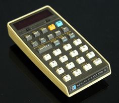 a calculator sitting on top of a black table