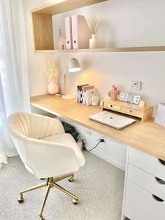 a white chair sitting in front of a desk