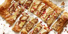 several slices of apple tart with pomegranate on top