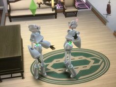 two robots standing in the middle of a living room with a green circle around them