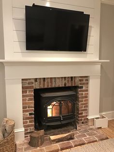 a fireplace with a flat screen tv above it