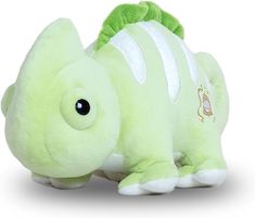 a green stuffed animal that is laying down