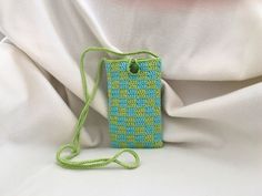 ✦Handmade Item / Finished product ✦This crochet tiny bag in green-blue colors is suitable for carrying small items like telephone, sun glasses, credit cards or wallet. It's checkered pattern offers a stylish appearance. It's a unique piece for your daily use  or a perfect gift for yor loved ones.  ✦Materials: 70 % cotton 30% polyester yarns are used. (Eco-friendly yarn is produced with organic certified dyes) Wooden bead button is used as fastener. ✦Dimensions: The body of the bag: 4,1 x 6,8 inc Green Rectangular Phone Bag For Daily Use, Trendy Blue Phone Bag As Gift, Trendy Blue Phone Bag For Gift, Rectangular Summer Phone Bag Gift, Trendy Green Square Phone Bag, Trendy Green Rectangular Phone Bag, Green Crochet Pouch Bag For Daily Use, Blue Rectangular Phone Bag As Gift, Green Pouch Phone Bag As Gift