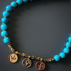 The Mystic Meditation Necklace is full of positive energy. In line with my belief that jewelry should bring good energy and have meaning, I included a variety of symbols and beautiful turquoise stones in this necklace. The Om mantra helps you tap into your inner world for peace, and the heal & dream charms remind you what's important in life. The evil eye symbol brings protection and turquoise stones are a must have for inner calm, all while looking stylish. The Evil Eye bead is a prominent symb Hand-strung Hippie Jewelry For Meditation, Hippie Hand-strung Jewelry For Meditation, Spiritual Turquoise Beaded Bracelets For Festivals, Bohemian Turquoise Necklace With 108 Beads For Gift, Spiritual Gold Turquoise Necklace With Gemstone Beads, Gold Turquoise Necklace With Gemstone Beads For Spiritual Style, Adjustable Spiritual Turquoise Necklace For Meditation, Spiritual Turquoise Necklaces For Festivals, Hippie Jewelry With 108 Beads For Meditation