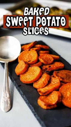 baked sweet potato slices on a slate board with spoons and plates in the background