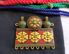 "Beautiful antique gold ethnic metal pendant with maroon meena work or connector for your jewelry. Size : Total length 2\" L and 2.25\" W approx. Base : Metal alloy. You will receive one pc of metal pendant. Pls check the size before ordering" Traditional Metal Temple Necklace With Meenakari, Traditional Meenakari Metal Temple Necklace, Traditional Meenakari Temple Necklace, Traditional Multicolor Rectangular Necklace, Traditional Rectangular Jewelry For Jewelry Making, Traditional Gold Rectangular Necklace, Ethnic Necklaces, Metal Pendant, Base Metal