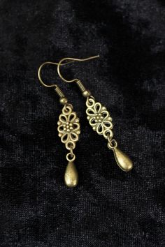 "These earrings are small and lightweight but very elegant and ladylike. If you want to add a little Victorian flair to your image without much commitment, this pair is a good find. DIMENSIONS: The earrings are 5/16\" (0.8 cm) wide. Total length will depend on the earwires of your choice. With hooks - 1 3/4\" (4.5 cm) long; With lever backs - 1 5/8\" (4.1 cm) long; With studs - 1 3/8 (3.5 cm) long With clip-ons - 1 1/2\" (3.8 cm) long NET WEIGHT: 0.07 oz (1.9 g) per earring Available with your c Elegant Hypoallergenic Metal Clip-on Earrings, Vintage Drop Earrings For Pierced Ears, Elegant Adjustable Nickel-free Teardrop Earrings, Adjustable Metal Plug Earrings Elegant Style, Elegant Adjustable Metal Plug Earrings, Adjustable Metal Plug Earrings, Elegant Style, Adjustable Elegant Metal Plug Earrings, Bronze Pierced Earrings For Formal Occasions, Adjustable Metal Plug Earrings