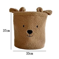 a brown teddy bear shaped storage bag with measurements for the top and bottom half of it