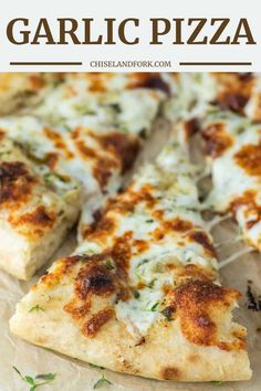 a close up of a slice of garlic pizza on a piece of parchment paper with text overlay