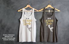 two women's tank tops hanging up against a wall with the word bride on them