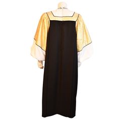 a black and gold dress with white collar