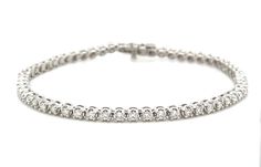 This beautiful Diamond Riviera Line Tennis Bracelet offers sparkling sophistication for any occasion with 1.95ct t.w. of dazzling diamonds, it will make you shine with undeniable elegance. Make your statement of style today! Metal: 14K White GoldDiamond Weight: Rounds Brilliant cuts 1.95ct t.w.Bracelet Length: 18cmLock: Box Catch With Hidden Safety Estimated production time is 4 - 5 weeks. Dazzling Diamond Tennis Bracelet With Pave Setting, Timeless Tennis Bracelet With Pave Setting In Cubic Zirconia, Timeless Cubic Zirconia Tennis Bracelet With Pave Setting, Classic Cubic Zirconia Diamond Bracelet With Pave Setting, Classic White Tennis Bracelet With Pave Setting, Classic Cubic Zirconia Bracelet With Pave Setting, Classic Pave Setting Tennis Bracelet, Diamond White Tennis Bracelet With Pave Setting, Diamond Tennis Bracelet With Pave Setting