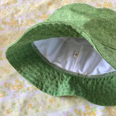 The perfect linen bucket hat! Made from a grass green linen blend fabric. This hat is very comfortable to wear. A great sun hat for women or men. I made this hat with a day of adventure in mind, somewhere sunny and wild! For baby or kid version of this hat, see link below. This hat is made from a grass green linen and cotton blend fabric. Inside liner is white cotton. Interfacing inside brim for extra shape. Brim measures approx. 2.5" wide. Crown measures approx. 3.5" deep. Available in sizes: S - measures 22.5" (fits heads with circumference of 21" to 22" best) M- measures 23" ( fits heads with circumference of 21.5 to 22.5" best) L- measures 23.5" (fits heads with circumference of 22" to 23" best) CUSTOM FIT: please contact me with head measurements. Custom fit hats are not eligible for Eco-friendly Bucket Hat For Spring Vacation, Green Cotton Outdoor Bucket Hat, Green Cotton Bucket Hat For Outdoor, Eco-friendly Spring Bucket Hat, Green Cotton Outdoor Hat, Eco-friendly Bucket Hat With Short Brim For Summer, Eco-friendly Short Brim Bucket Hat For Summer, Eco-friendly Short Brim Summer Bucket Hat, Green Brimmed Sun Hat For Outdoor