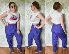 "P4 These 80's/90's nylon pants are bright and fun! -Tag: Adolfo II -Fabric is 100% nylon outer shell with white cotton poly lining (fully lined) -Tag says size Large (please see measurements) -Solid bright purple -Made to slip on with an elastic waist (stretches 30-40 inches around) -2 side pockets -Excellent vintage condition with no holes or stains. Just crisp and lovely. Please see photos. Feel Free to Message Me With Any Questions. Measurements Taken While Flat (multiply x 2): These pants a 90s Style Parachute Pants For Spring, Grape Crush, Sports Track Pants, Waist Stretches, Nylon Pants, Bright Purple, Black Sleeveless, 1960s Vintage, Track Pants