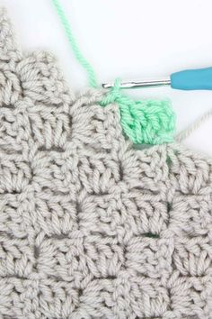 the corner to corner crochet stitch is being worked on