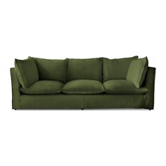 a green couch sitting on top of a white floor