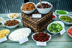 a table topped with bowls filled with different types of food