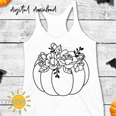 a white tank top with black and white flowers in a pumpkin design on the front