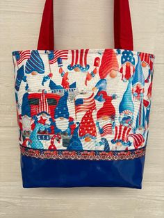 "July Gnomes fabric purse with a Blue vinyl bottom and ribbon trim. Coordinating inside fabric with 3 pockets and a magnetic snap. 2 red  27\"  fabric handles are lined with belting for durability. Ribbon may vary depending on availability All fabrics are interfaced for stability 11.5\"wide. 11.5\" tall and 3.5\" bottom" Red Fabric Bag For Everyday Use, Red Fabric Shoulder Bag For Shopping, Red Fabric Shoulder Bag For Daily Use, Red Fabric Bag For Daily Use, Red Fabric Shoulder Bag For Travel, Fabric Purse, Fabric Purses, Blue Vinyl, Handmade Handbags