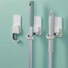 three white wall mounted medical devices on a green wall with the words meltset above them