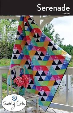 a book cover with a colorful quilt on it