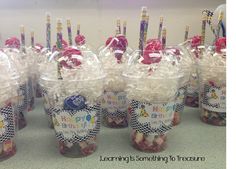 plastic cups filled with candies and candy