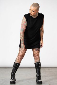 RAPTOR.- Soft, super stretch ribbed fabric.- Statement shoulder lapels.- Sleeveless.- Fitted.- Unisex, so it's for everyone.Model with black hair is 5ft 11 and wears a size L, Model with the tattooed head is 5ft 7 and wears a size L for an oversized look.with KILLSTAR branding, 93% Rayon 7% Elastane. Black Fitted Sleeveless Muscle Tee, Edgy Stretch Sleeveless Vest, Alternative Style Stretch Sleeveless Tank Top, Alternative Stretch Sleeveless Tank Top, Stretch Sleeveless Alternative Tank Top, Punk Sleeveless Tops For Fall, Alternative Sleeveless Tops For Night Out, Alternative Style Sleeveless Tops For Night Out, Alternative Style Tank Top For Night Out