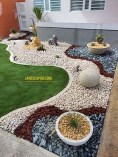 an outdoor area with grass, rocks and plants on the side of a house that has landscaping zone written across it