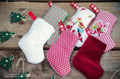 christmas stockings and stocking laying on a wooden surface