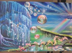 a painting is shown with bubbles floating in the air and on top of it are flowers