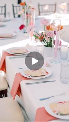 the table is set with plates and place settings