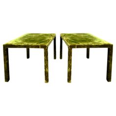 two tables made out of wood and green marbled tops, each with a square shaped top