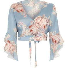 River Island Blue floral wrap frill sleeve crop top ($60) ❤ liked on Polyvore featuring tops, blue, crop tops / bralets, women, 3/4 sleeve tops, blue top, cropped tops, v-neck tops and floral crop top Bralet Tops, Stylish Crop Top, Island Blue, Blue Floral Top, Wrap Crop Tops, Blue Crop Tops, Crop Top Shirts, Floral Crop Tops, Saree Blouse Designs