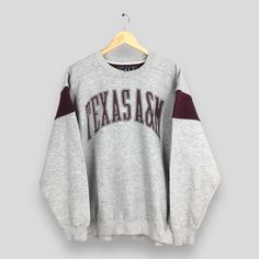 Vintage Texas A&M University Aggies Sweatshirt Medium Texas Aggies Printed Spell Out Jumper Ncaa Texas Aggies Sweater Texas Pullover Size M Size On Tag : Size M Manual Measurement :- WIDTH (armpit to armpit) :- 22.5" inches LENGTH (shoulder to end of garment) :- 28" inches WEIGH :- 0.67 kg Condition :- Good Condition. No stain and holes. - Colors Might Be Different Due To Lighting. - All items are VINTAGE which show some signs of wear and tear. FEDEX EXPRESS = 3-6 business day arrived Please provide your PHONE/CONTACT NUMBER for SHIPPING/DELIVERY purpose.  VERY IMPORTANT ‼ for safer and easier delivery processes. REF - Z-22012024-3582 Gray Fall Sweater For College, Relaxed Fit Throwback Tops For Fall, Collegiate Sports Sweater For Fall, Gray Long Sleeve College Sweater, Throwback Long Sleeve Tops For Game Day, Gray Long Sleeve Sweater For College, Throwback Letter Print Tops For Fall, Oversized Throwback Fall Tops, Throwback Cotton Tops For Fall